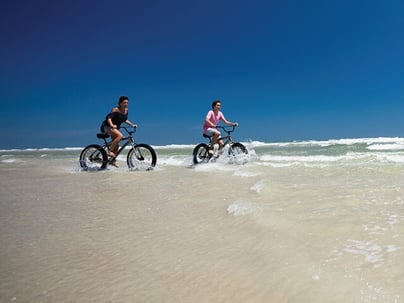 Mom and son riding beach cruisers in New Smyrna Beach-2