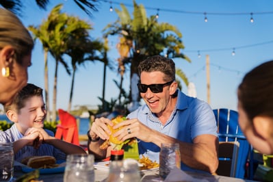 New Smyrna Beach - River Deck Tiki Bar & Restaurant - Family Eating 1 - 2025 (Roundhouse Creative)-1