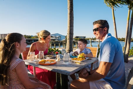 New Smyrna Beach - River Deck Tiki Bar & Restaurant - Family Eating 2 - 2025 (Roundhouse Creative)
