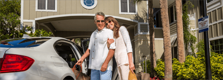 Couple Arriving at Hampton Inn Entrance