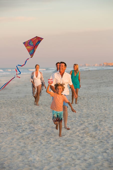 Family Flying a Kite at the Beach